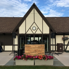 Stacked natural Barn wood DJ booth at Interlachen Open Lawn space