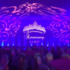 Quinceanera monogram with lighting and ceiling swirl pattern