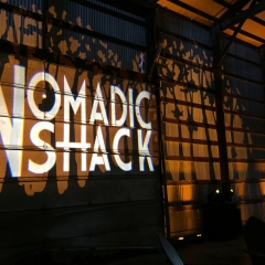 Nomadic Shack monogram with trees in background for company launch event